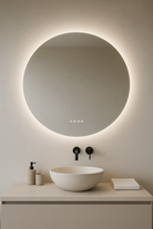 Bathroom vanity with round LED mirror and white sink