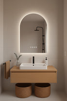 Modern bathroom setup with a vanity, mirror, and shower fixtures.