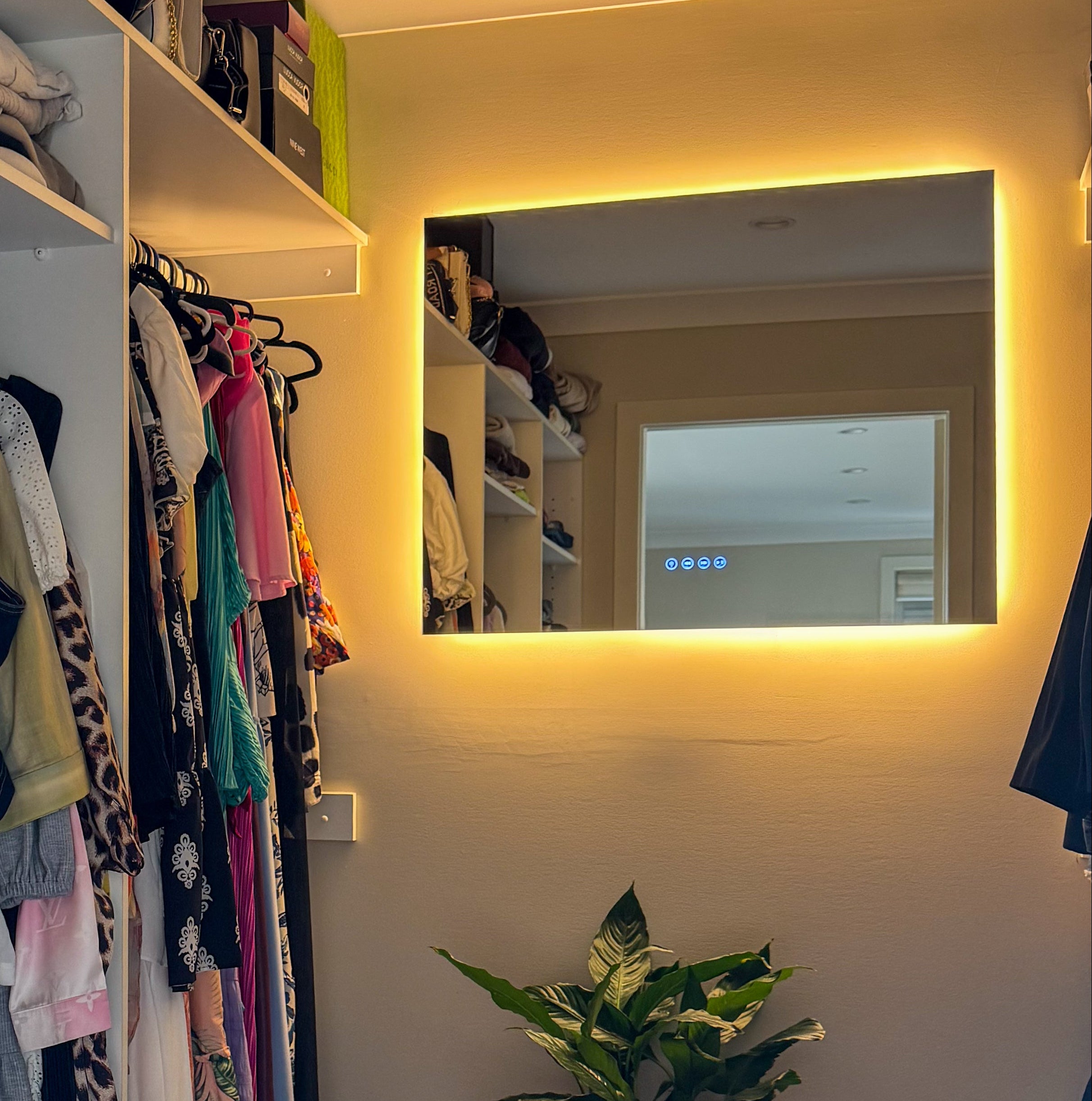 Rectangular LED mirror used in walk in wardrobe 